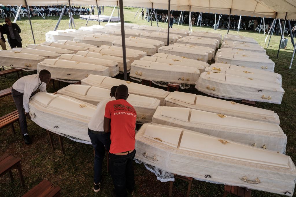 Coffins containing newly discovered remains of 84,437 victims of the 1994 genocide during a funeral in Kigali on 4 May 2019, 25 years after the slaughter. 