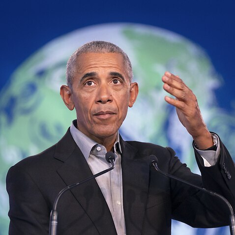 Former US president Barack Obama delivers a speech to delegates during the COP26 summit 
