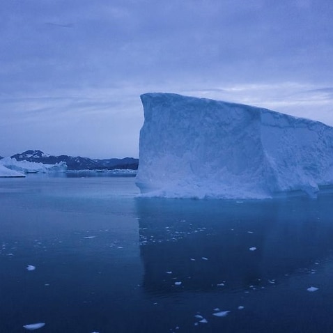 Boat navigated icebergs in eastern Greenland.