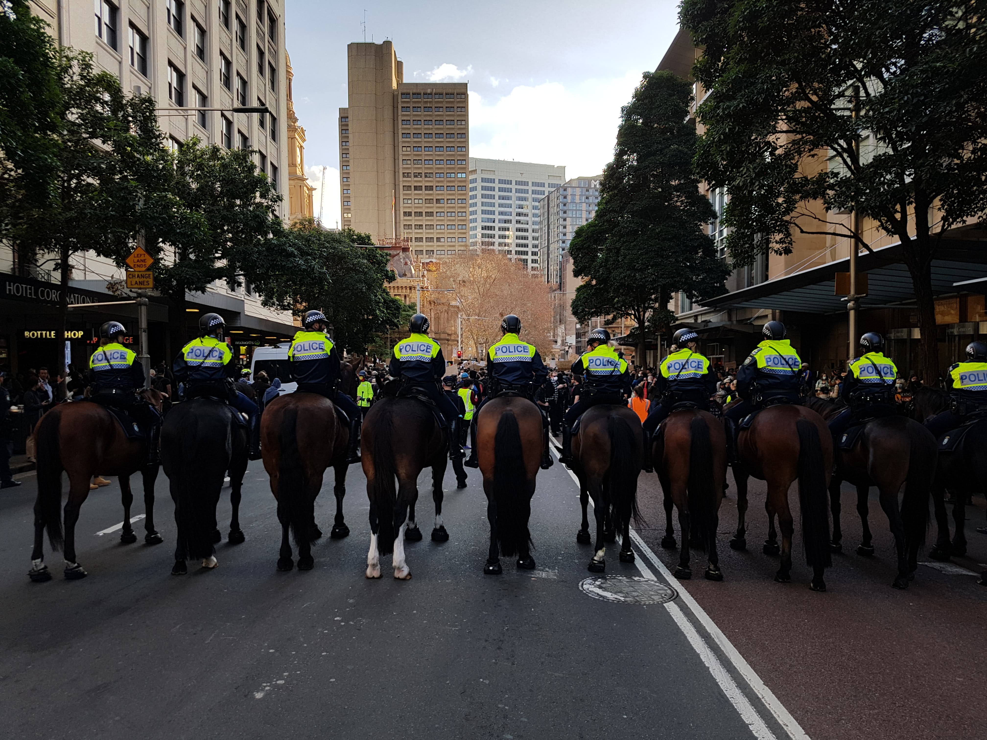Police on horseback monitor the crowd in Sydney. One man, who was shouting Police on horseback monitor the crowd. One man, who was shouting "all lives matter" was taken away in handcuffs and later released.