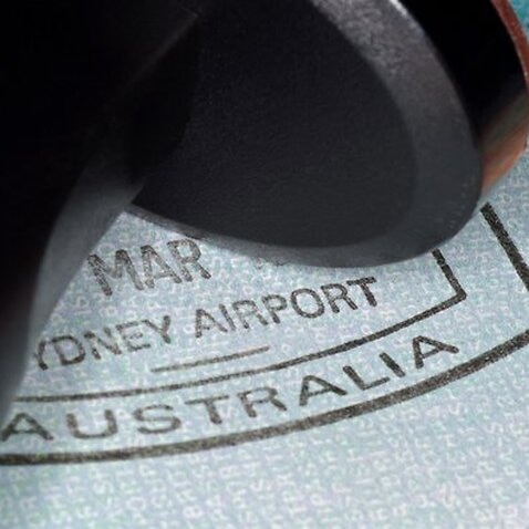 A passport with Australian immigration stampand visa