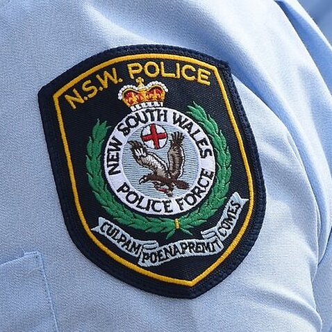 Stock image of New South Wales Police badges in Sydney, Friday, Aug. 16, 2013.  (AAP Image/Dean Lewins) NO ARCHIVING