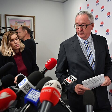 Health Minister Brad Hazzard (right) and NSW Chief Health Officer Dr Kerry Chant arrive to speak to the media in Sydney, Wednesday, March 4, 2020. (AAP Image/Joel Carrett) NO ARCHIVING