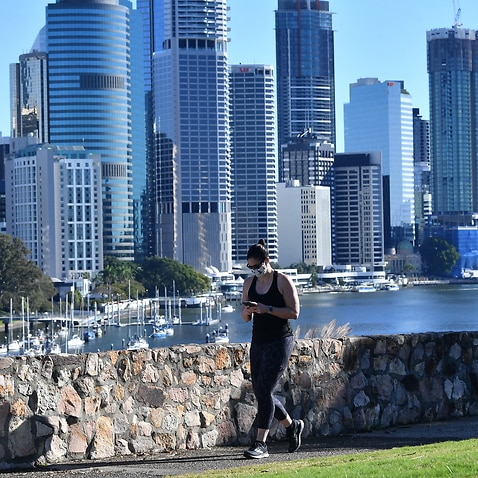 A woman is seen exercising at Kangaroo Point in Brisbane, Thursday, August 5, 2021, as the city remains in lockdown.