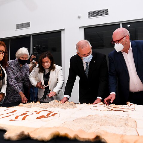 (L-R) Daughter of the late Sir Robert Menzies Heather Henderson, Chairperson of AIATSIS Jodie Sizer, Jenny Morrison, Australian Prime Minister Scott Morrison and CEO of AIATSIS Craig Ritchie look at Indigenous artefacts as they tour the Australian Institu
