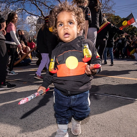 Brian Liddle Jr participates in a NAIDOC week march in Melbourne, Friday, July 6, 2018. 