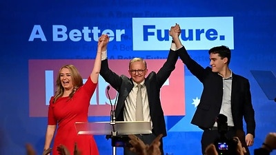 Australian Opposition Leader Anthony Albanese celebrates with his partner Jodie Haydon and son Nathan Albanese after after winning the 2022 Federal Election