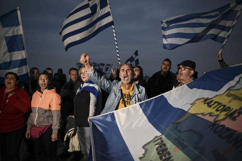 Greek protesters chant slogans against Greece's name deal with neighboring Macedonia, during a rally in the northern city of Thessaloniki, on Sunday, Sept. 30, 2018.