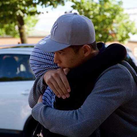 Mahdi Azizi hugs his mother goodbye before boarding a bus to return to a centre for unaccompanied minors, in Vasteras, Sweden.