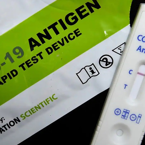 A rapid antigen test (RAT) showing a negative result. 