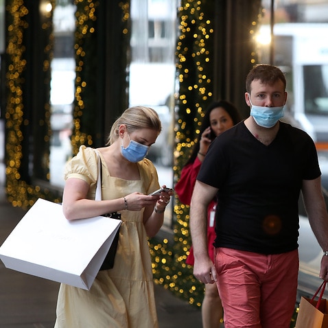 Shoppers walk in Sydney's CBD on 24 December. 