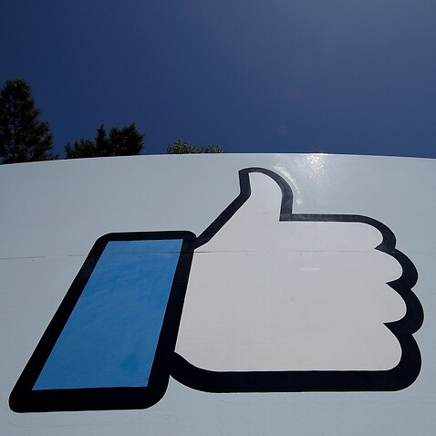 FILE, April 25, 2019, file photo shows the thumbs-up Like logo on a sign at Facebook headquarters in Menlo Park, California 