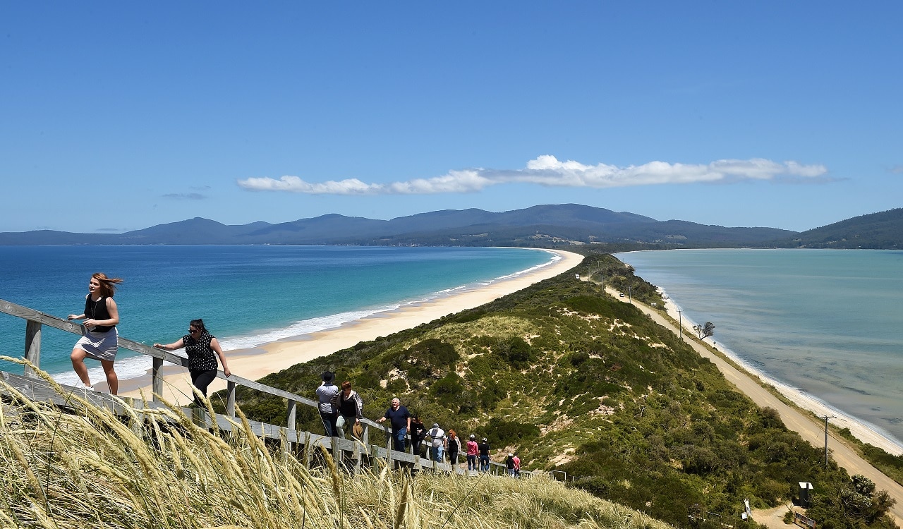 Tourists walk to a lookout at 'The Neck' on Bruny Island, off south eastern Tasmania.
