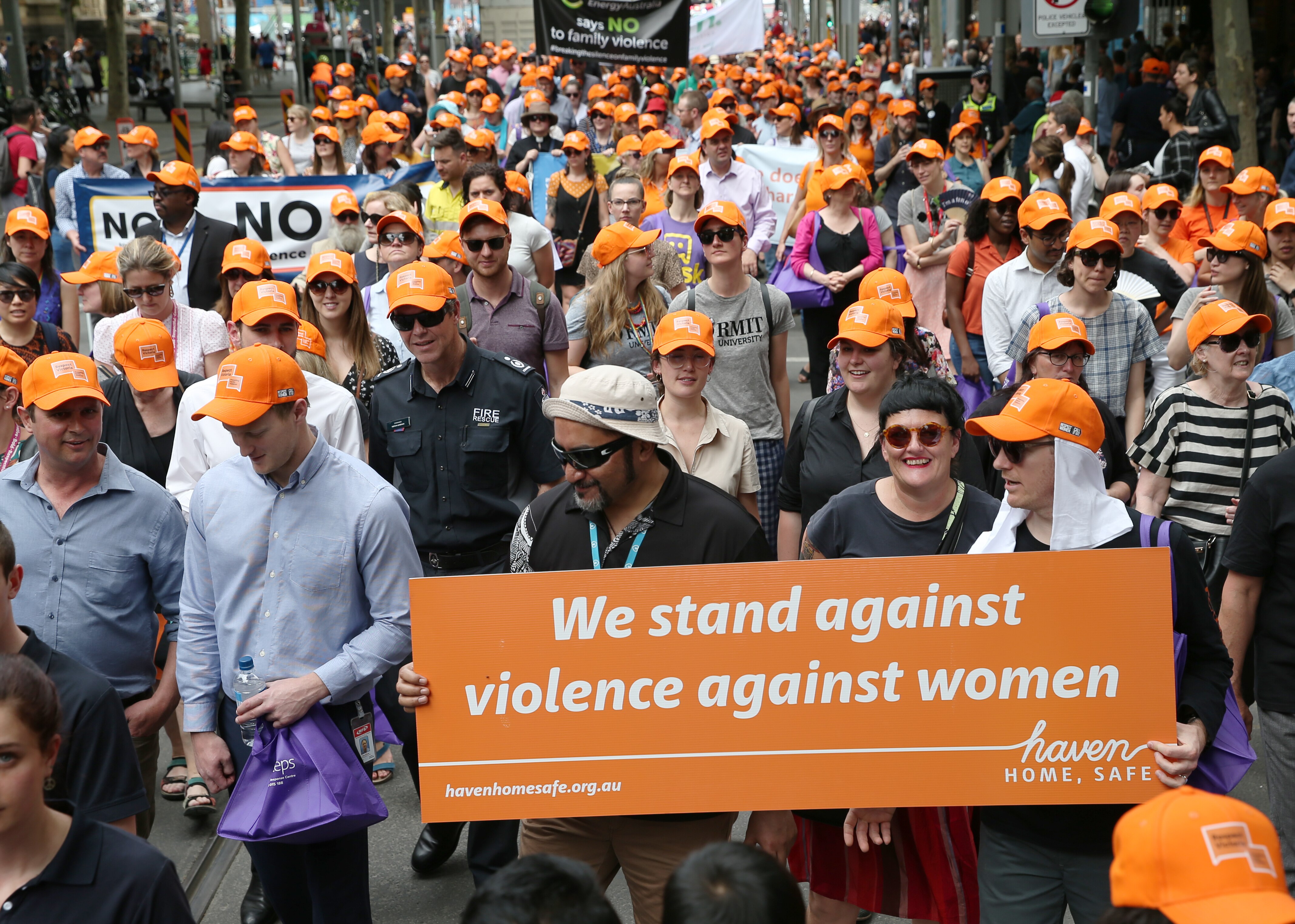 Participants are seen marching during the 11th annual Walk Against Family Violence in Melbourne, Monday, November 25, 2019. (AAP Image/David Crosling) NO ARCHIVING