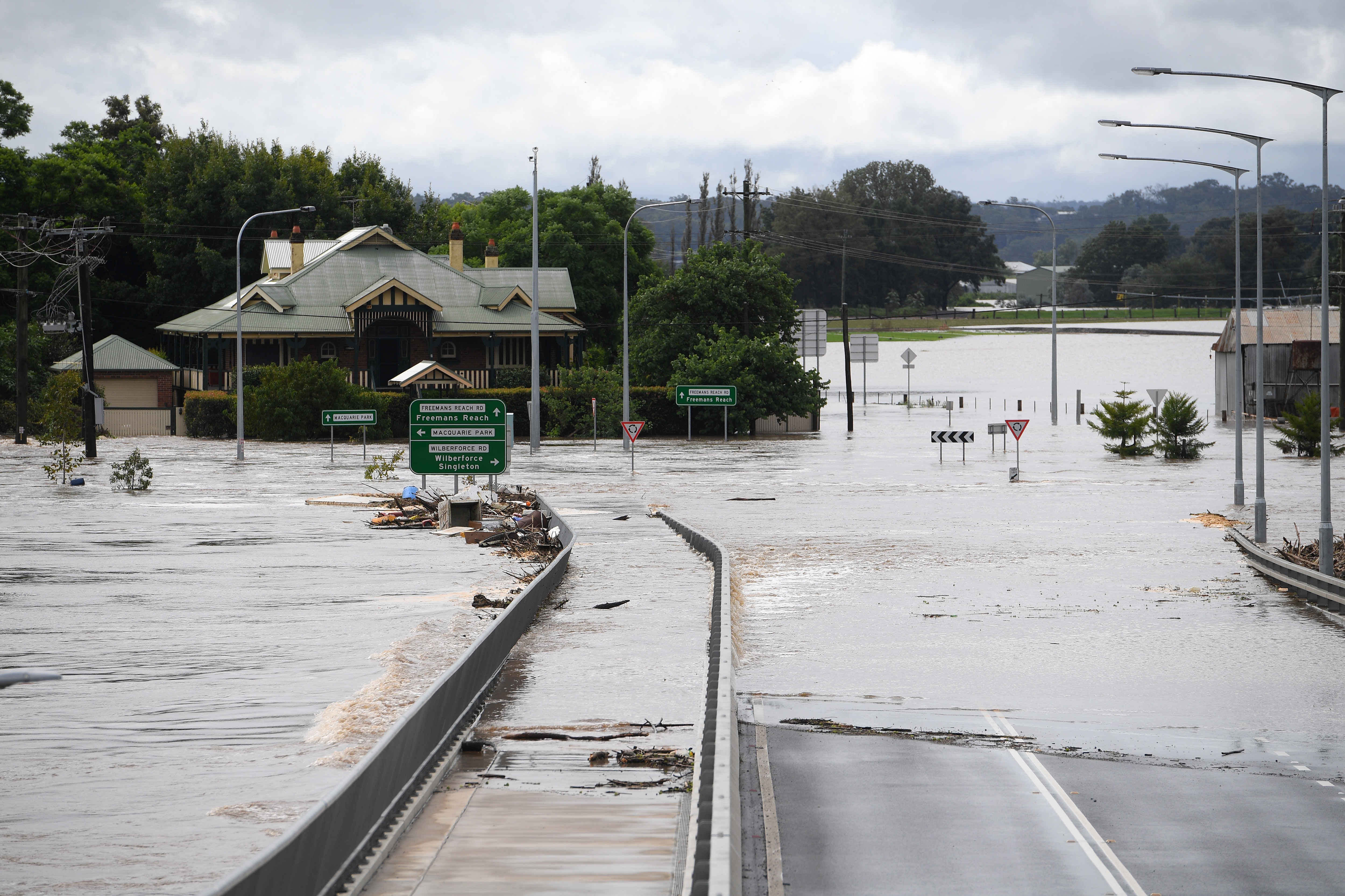 NSW and Queensland floods claimed 13 lives and damaged thousands of homes and businesses