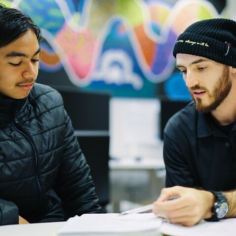 Daniel Curran tutoring a student in the Indigenous Tutorial Assistance Scheme at Curtin’s Centre for Aboriginal Studies.