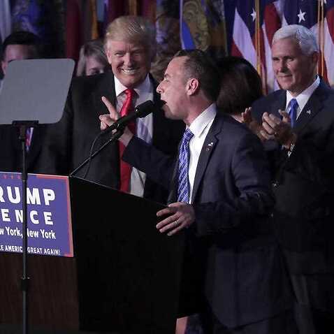 Reince Priebus, Chair of the Republican National Committee, right, speaks as President-elect Donald Trump gives his acceptance speech 