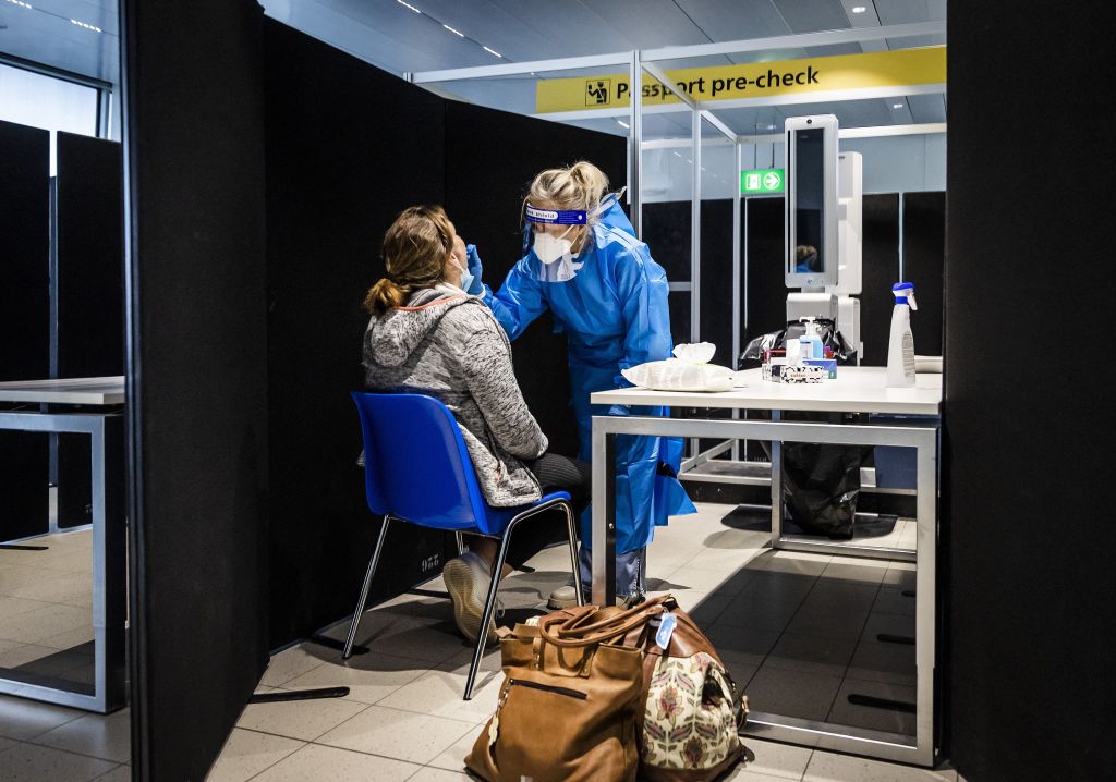 Travelers from South Africa are tested for the coronavirus (Covid-19) on arrival in a specially designed test street at Schiphol airport, on 30 November, 2021.