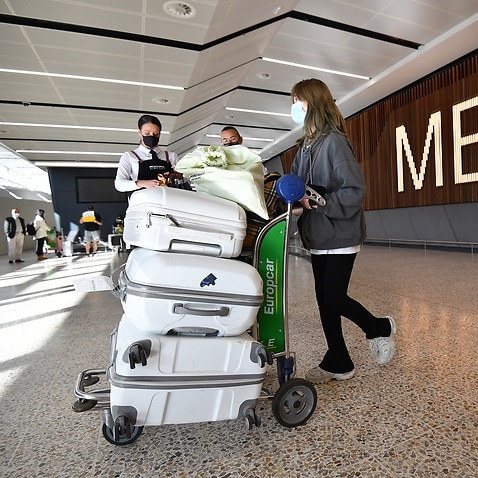International passengers arrive at Melbourne Airport in Melbourne, Monday, February 21, 2022. Australia’s international borders have reopened without restrictions for fully vaccinated tourists and travellers. (AAP Image/Joel Carrett) NO ARCHIVING