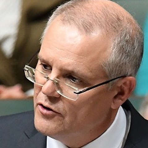 Federal Treasurer Scott Morrison hands down his third Federal Budget in the House of Representatives at Parliament House in Canberra, Tuesday, May 8, 2018. (AAP Image/Dean Lewins) NO ARCHIVING