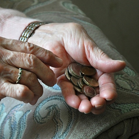 Undated handout photo of an elderly woman counting loose change. About one in five female pensioners is living in poverty, according to Age UK.