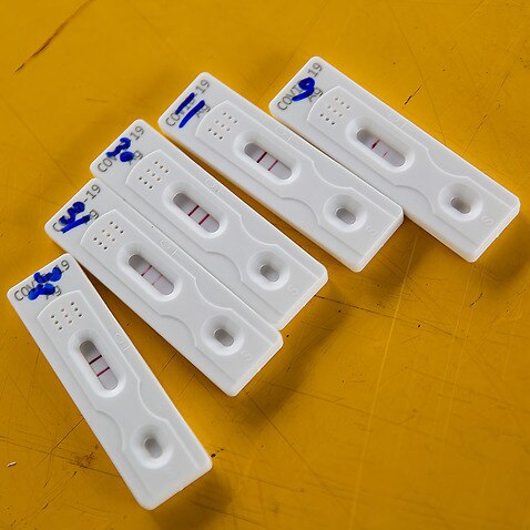 COVID-19 rapid antigen test kits seen on a table during the mobile COVID -19 testing at Chalong Krung housing community in Thailand.