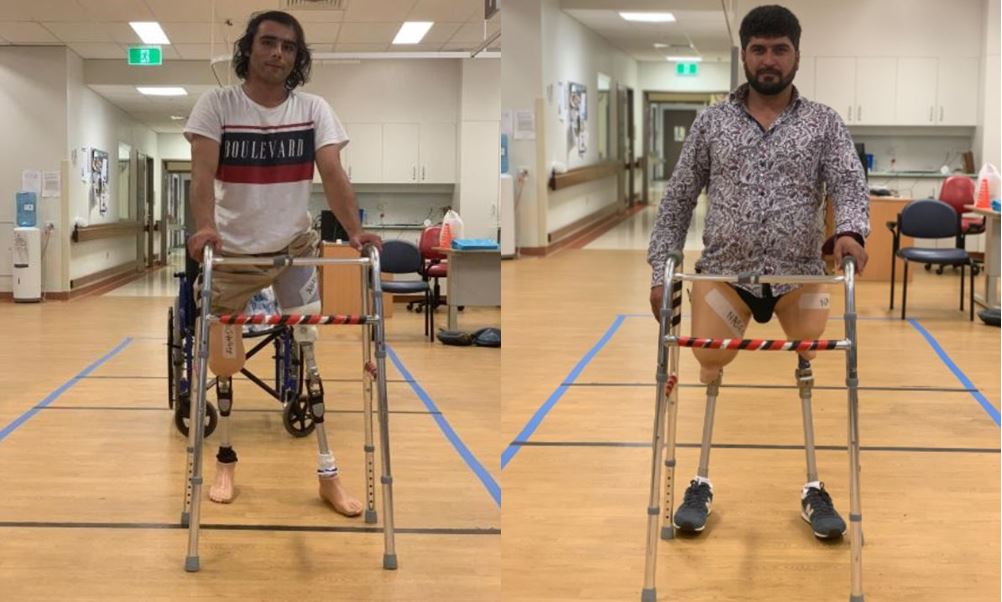 Abdul Wali Ahmadzai and Sohail Naseri trying out their new prosthetics.