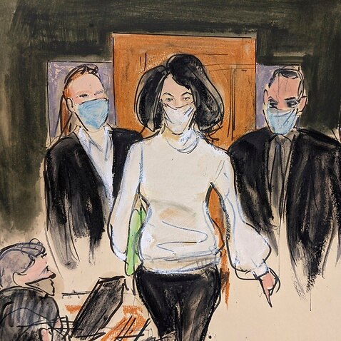 In this courtroom sketch, Ghislaine Maxwell enters the courtroo at the start of her trial, Monday, November 29, 2021