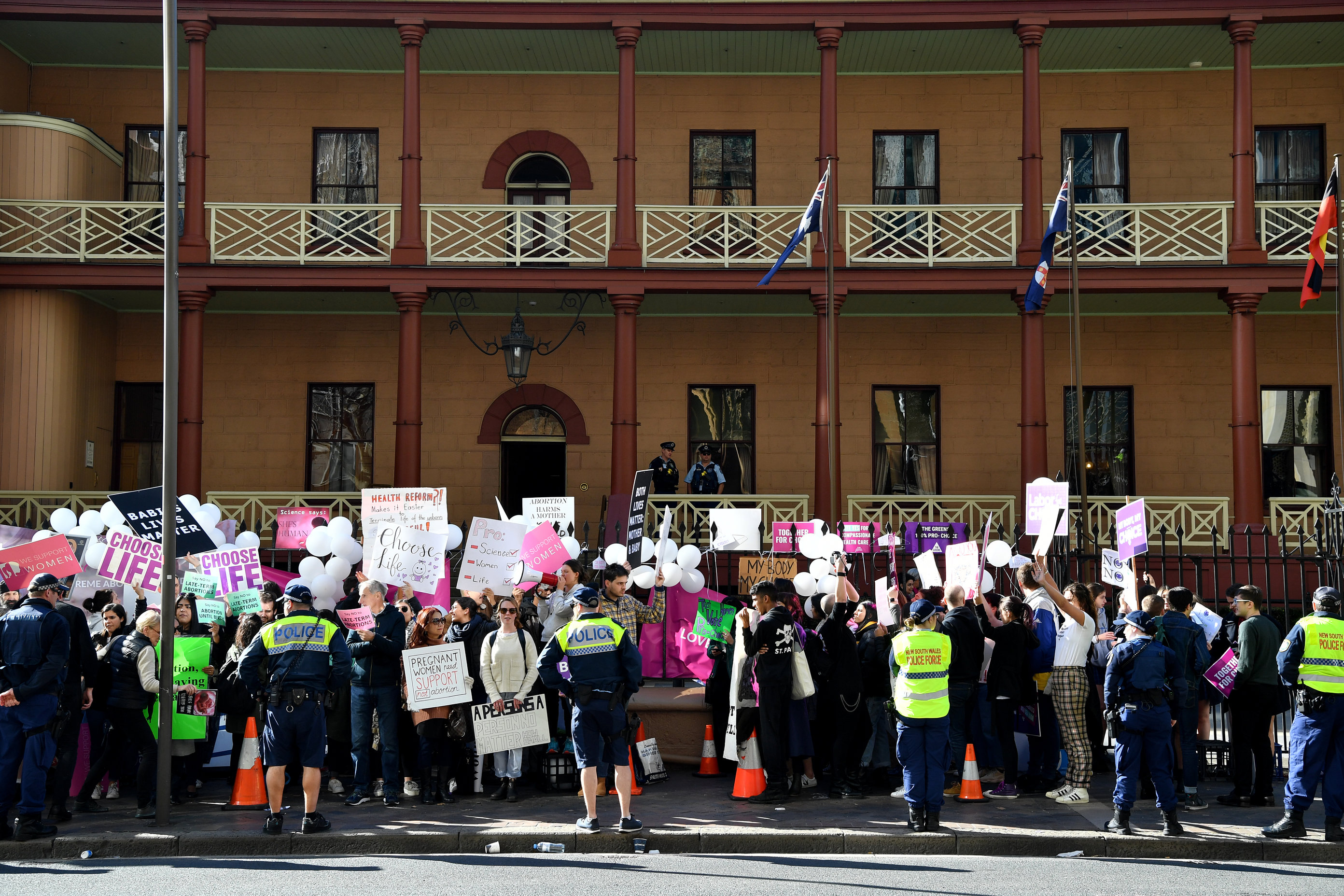 Opposing groups protest outside the NSW parliament as abortion legislation is debated.