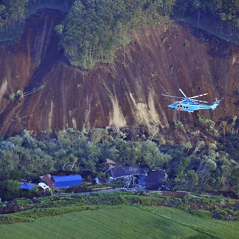 An aerial photo shows landslides that seem to be happened by the earthquake in Atsuma Town, Hokkaido on Sep.6, 2018. 