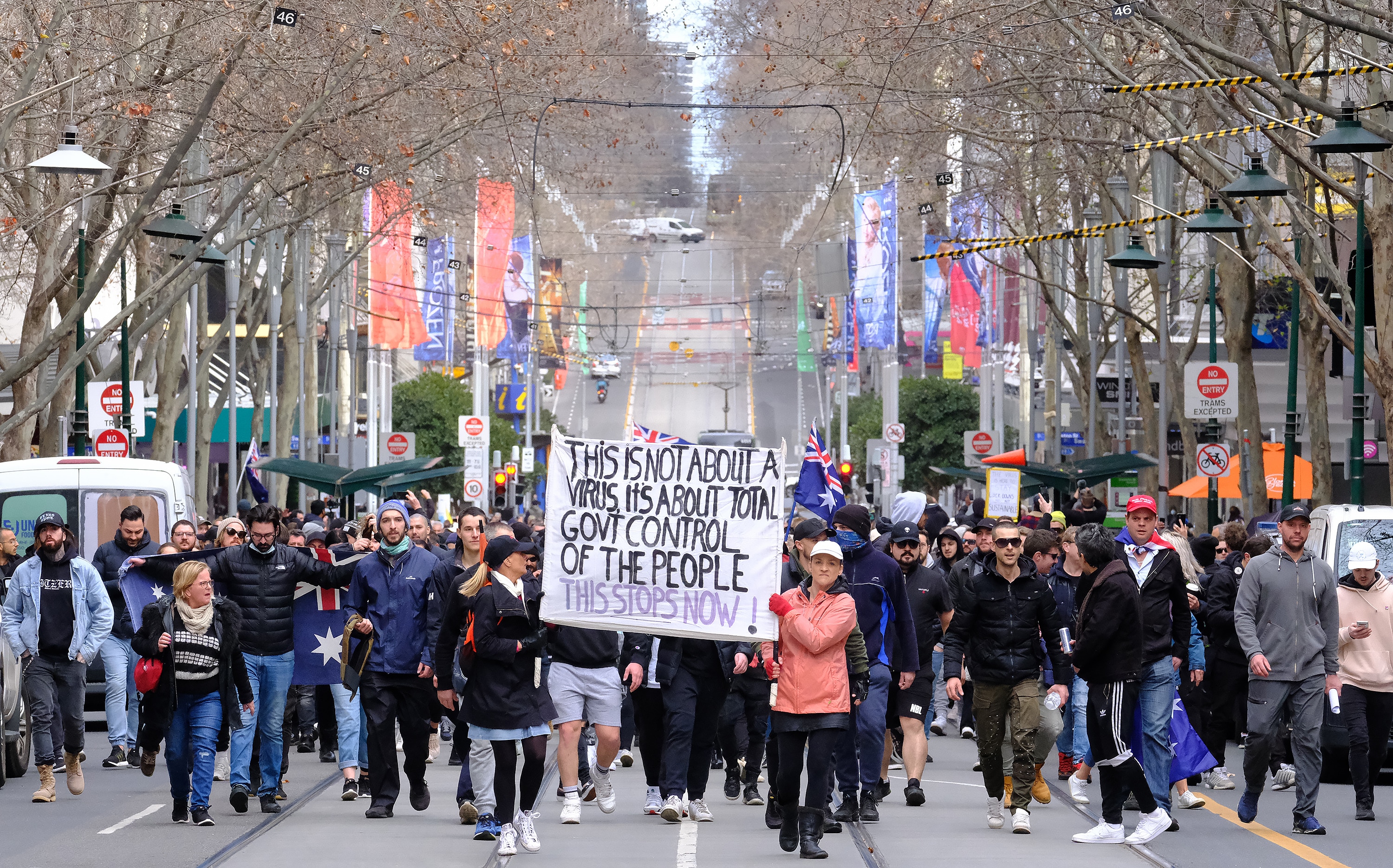 Protesters are seen during the â€˜World Wide Rally For Freedomâ€™ anti-lockdown rally in Melbourne, Saturday, July 24, 2021. (AAP Image/Luis Ascui) NO ARCHIVING