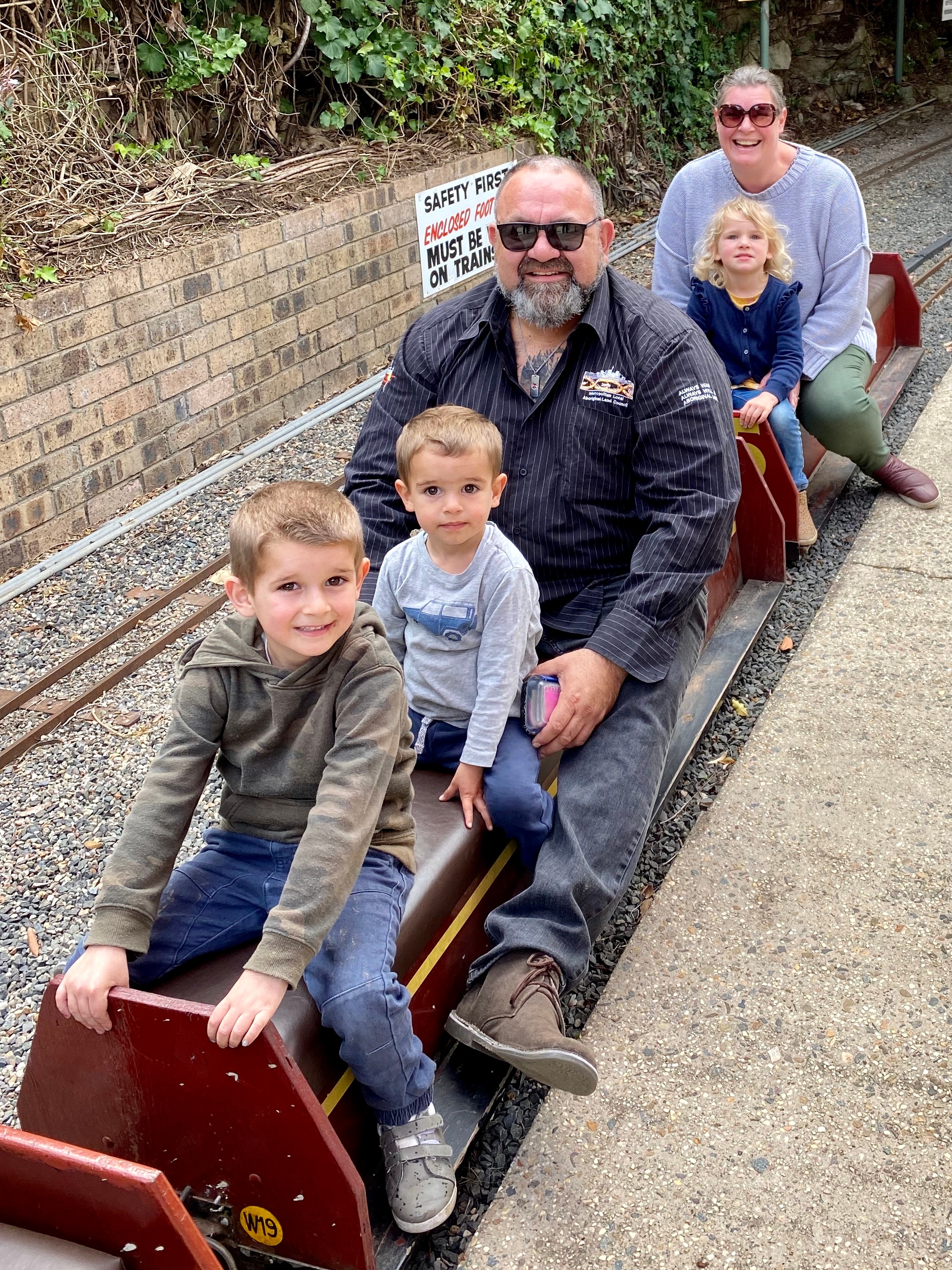 Brendan with three of his eight children.