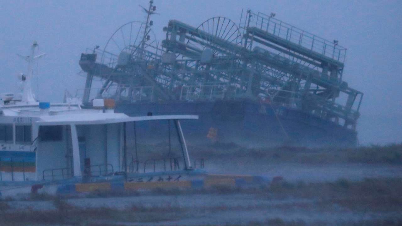 A ship washes ashore at a port in Yonabaru, Okinawa Prefecture.