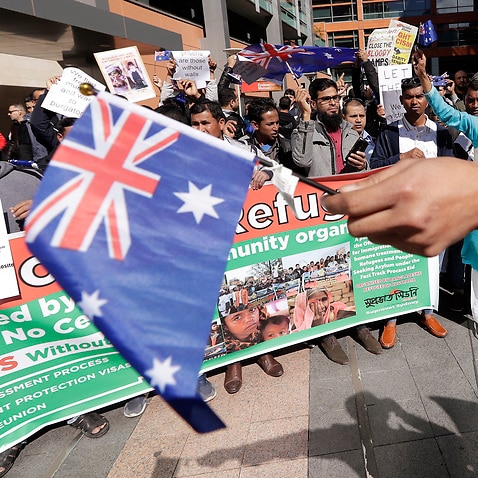 Hundreds protest the uncertain futures of many refugees since Australia replaced permanent protection visas with temporary visas in Sydney.