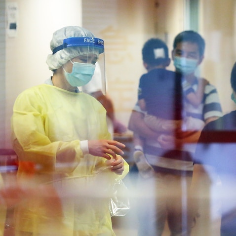 Medical staff at the Kwong Wah Hospital in Yau Ma Tei are seen in protective outfits.