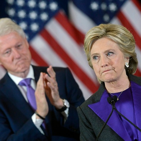 Democractic presidential candidate Hillary Clinton (R) delivers her concession speech next to her husband former US president Bill Clinton (L)