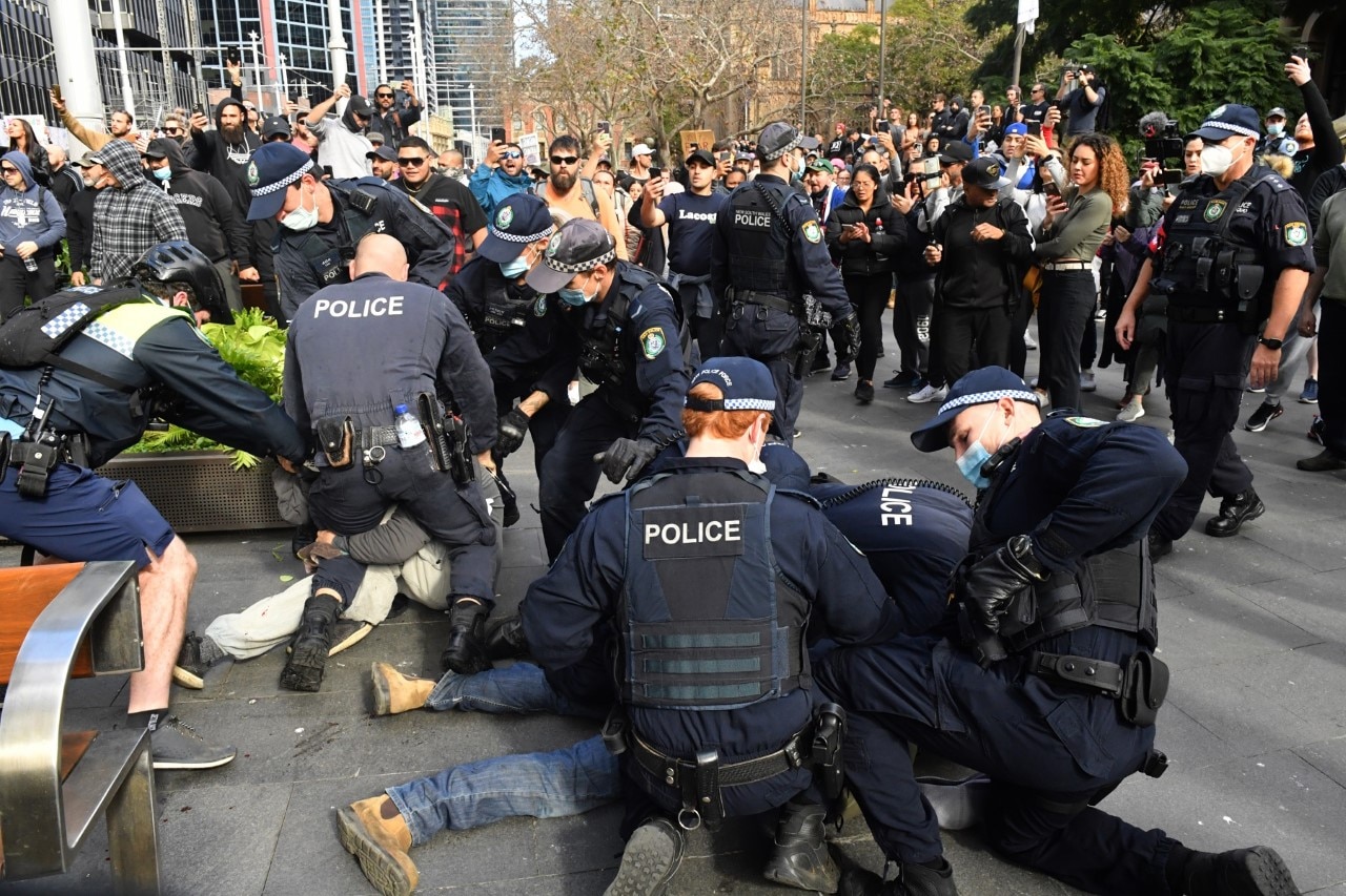 Police and anti-lockdown protesters on the streets of Sydney.