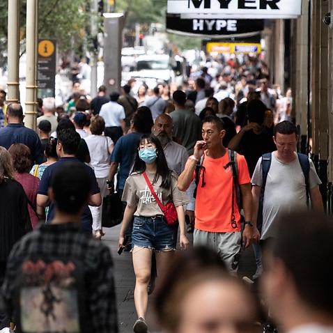 People seen wearing face masks on Pitt Street, Sydney, Friday, 18 December, 2020. 