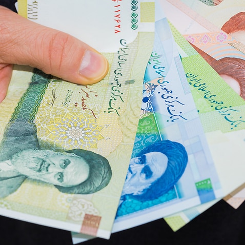 Iranian Riyal Money, Various Values, Banknotes spread out and held in the hand