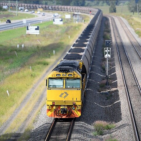 A loaded coal train is seen passing through the outskirts of Singleton, in the NSW Hunter Valley region
