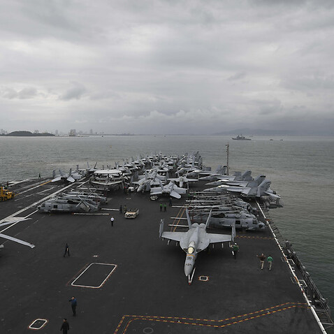 The aircraft carrier USS Theodore Roosevelt (CVN 71) and guided-missile cruiser USS Bunker Hill (CG 52) arrive in Da Nang