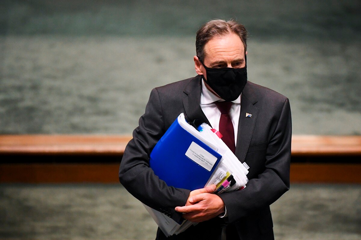 Australian Health Minister Greg Hunt arrives during House of Representatives Question Time at Parliament House in Canberra, Thursday, October 29, 2020. 