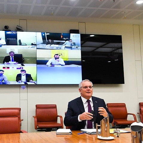 Australian Prime Minister Scott Morrison holds a national cabinet meeting with state and territory leaders, at Parliament House in Canberra, Thursday, December 30, 2021. National cabinet is meeting to discuss a consistent definition of a close contact and