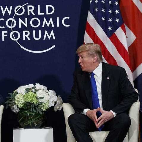 File print of US President Donald Trump assembly with British Prime Minister Theresa May during a World Economic Forum in Davos, Switzerland.