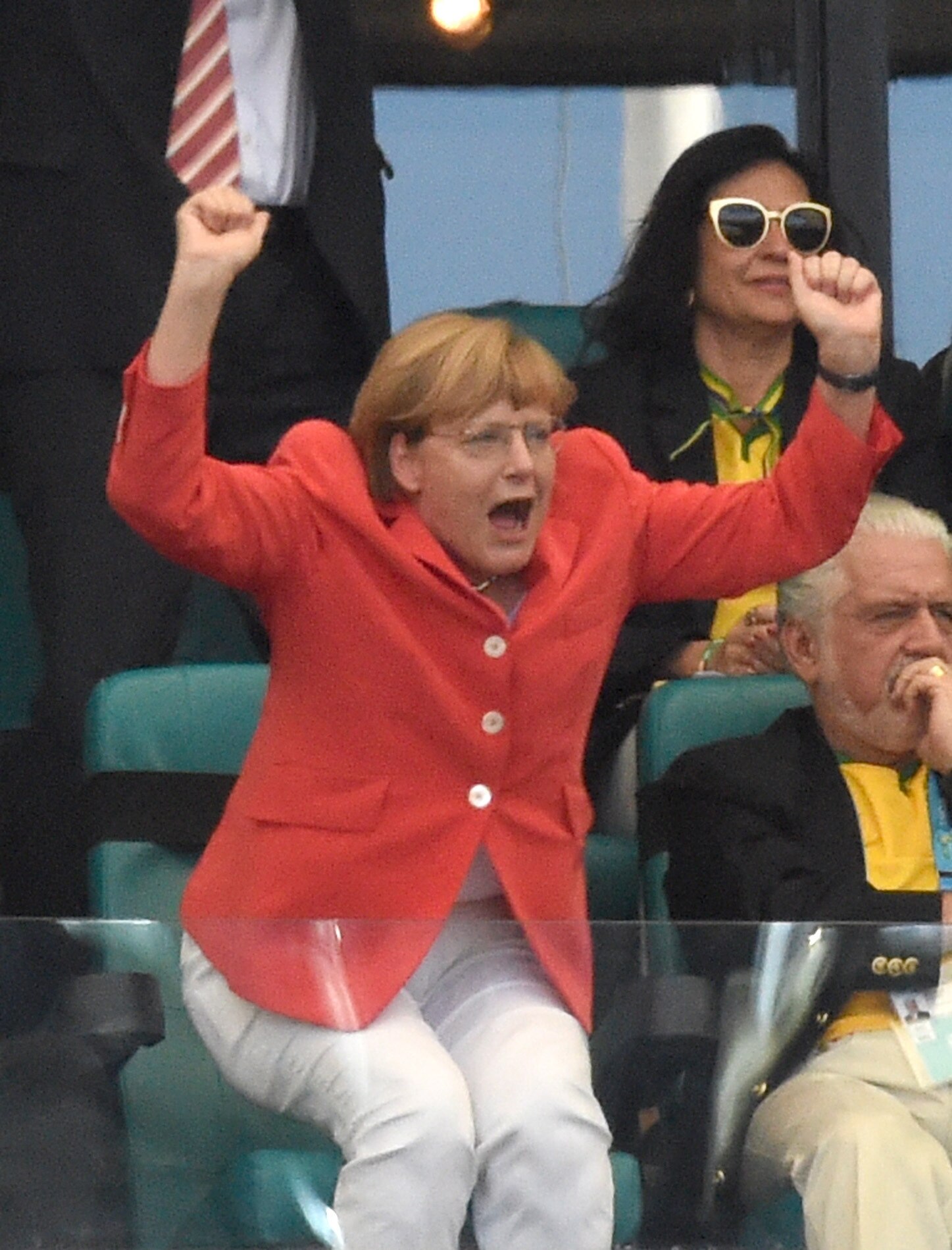 Angela Merkel celebrates Germany's 2-0 goal in the FIFA World Cup 2014 match between Germany and Portugal