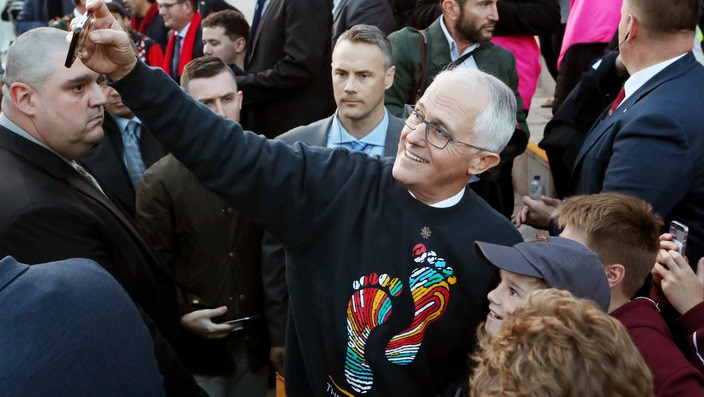 Prime Minister Malcolm Turnbull takes a selfie with a supporter at the 14th annual Long Walk.